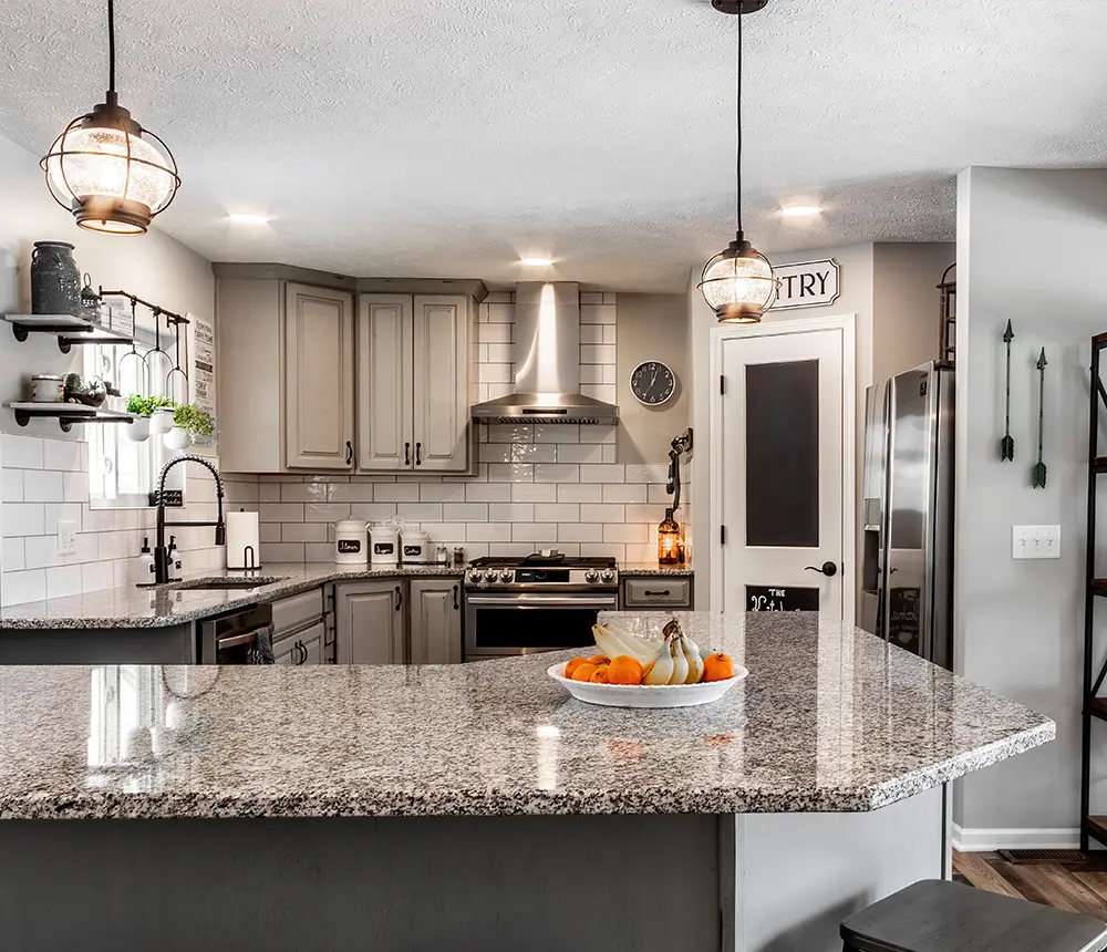 Modern kitchen remodel in Papillion, NE with gray cabinets, walk-in pantry, and custom tile work by Home Matters Construction