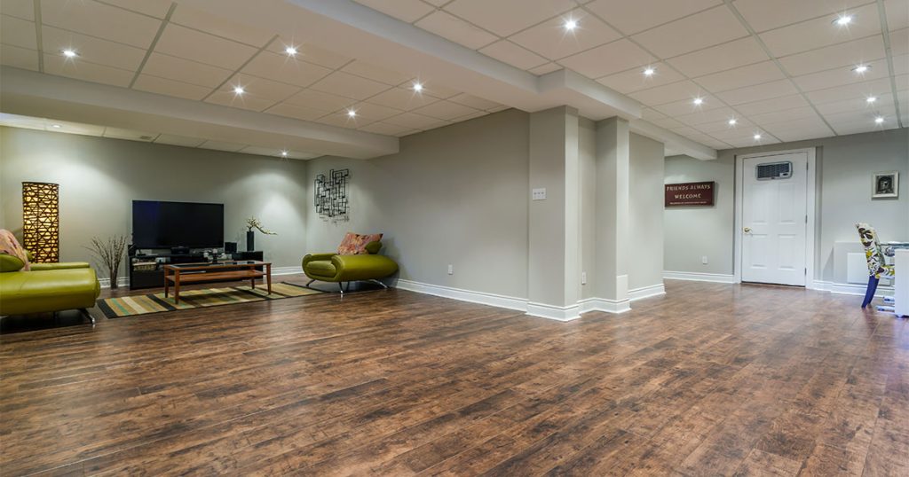 An engineered wood floor in a basement living space