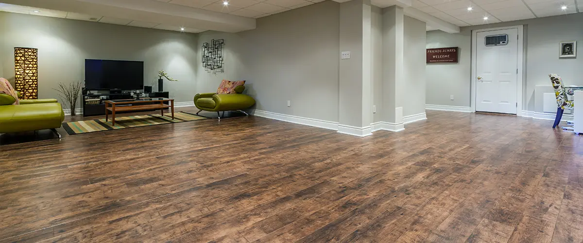 An engineered wood floor in a basement living space