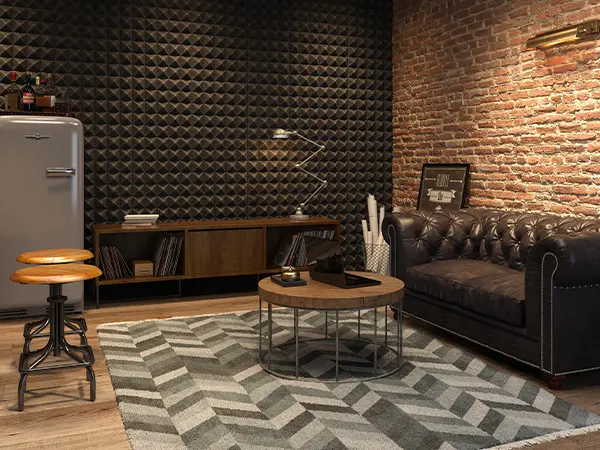 A cool office in a basement with bricks and leather couch