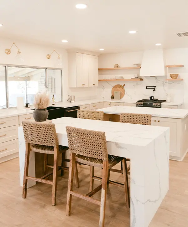 A beautiful quartz waterfall countertop for a kitchen island