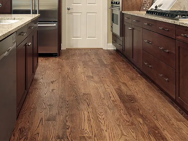 Wood cabinets with wood flooring in a kitchen