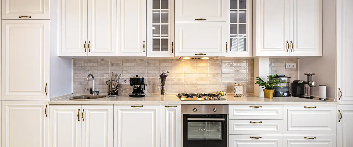 White kitchen cabinets with appliances