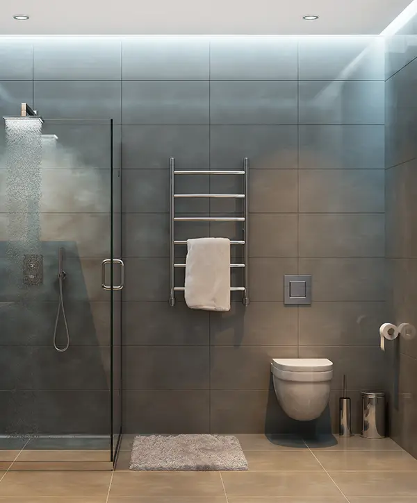 A bathroom with gray tile flooring and walls