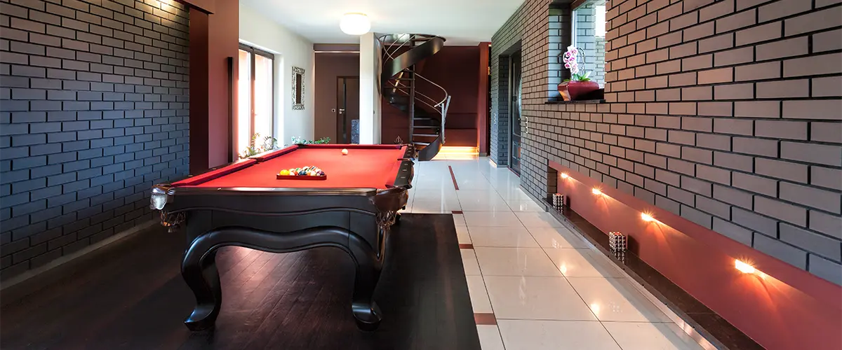 A man-cave in a walk-out basement with french doors