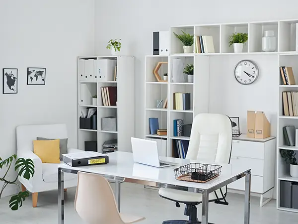 An office with a lot of open shelves