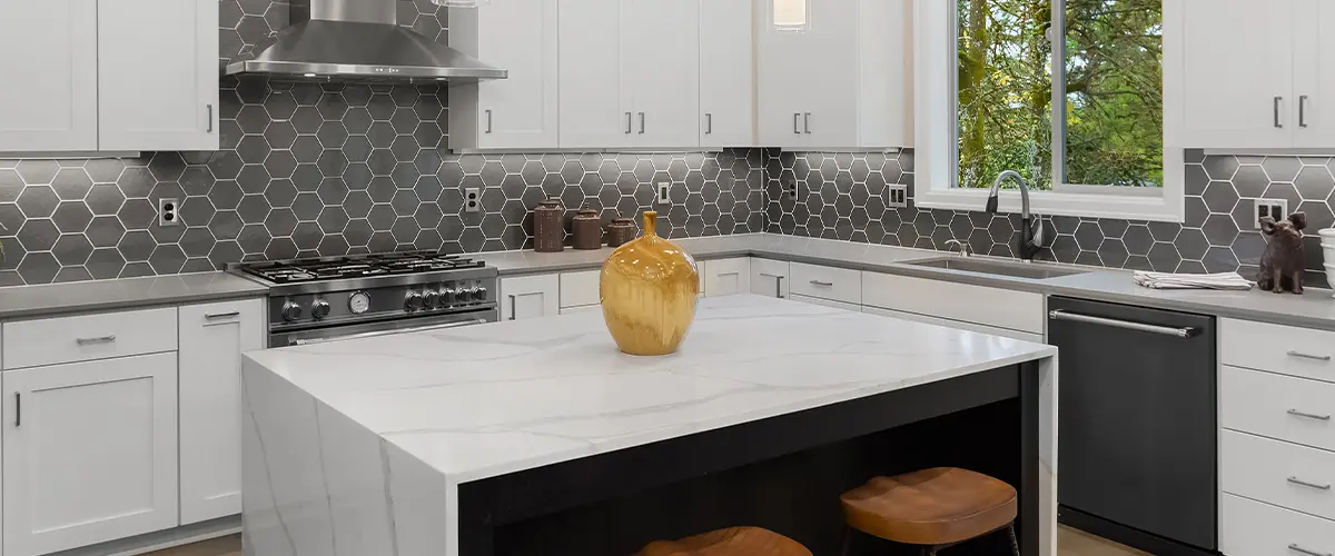 Quartz countertop with white kitchen cabinets