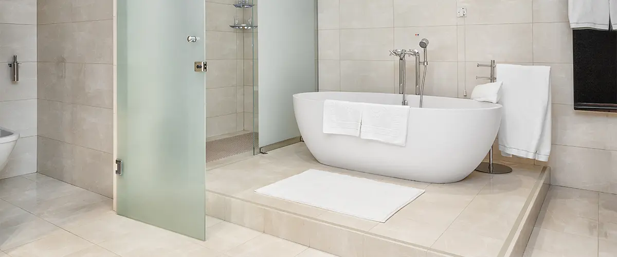 Italian porcelain tile flooring in a bath with a glass walk-in shower and tub