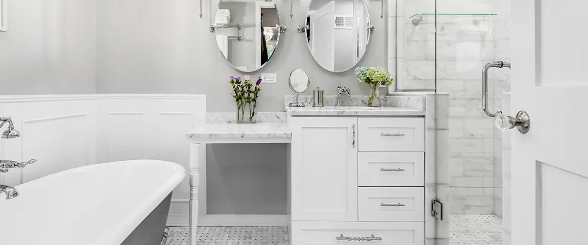 Tub and white bathroom vanity