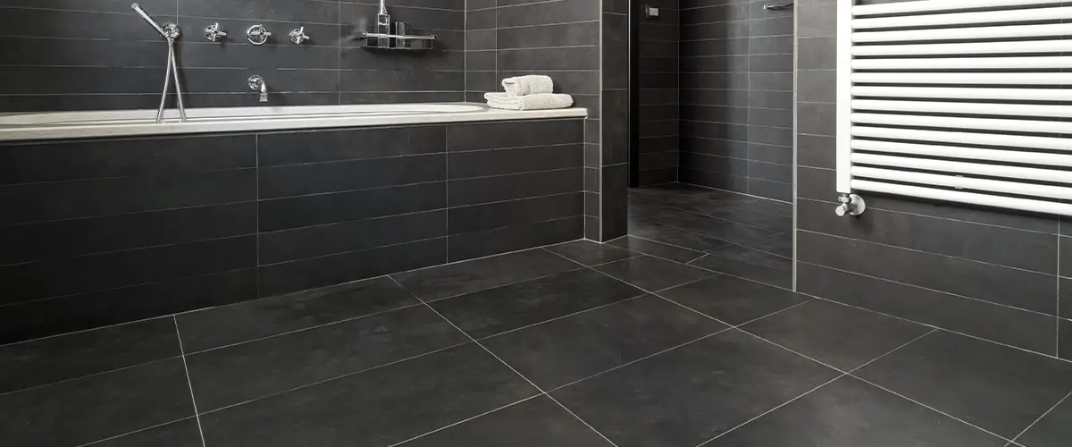 Black tile flooring and walls