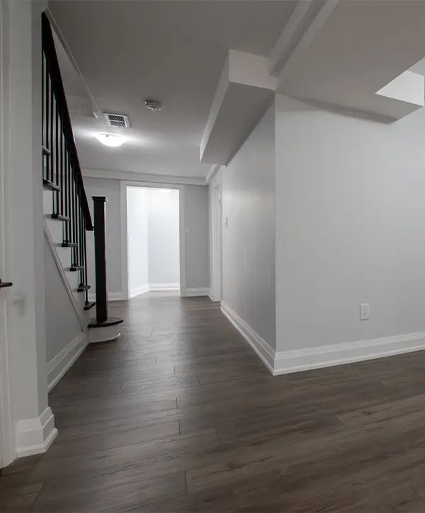 An empty basement with LVP flooring