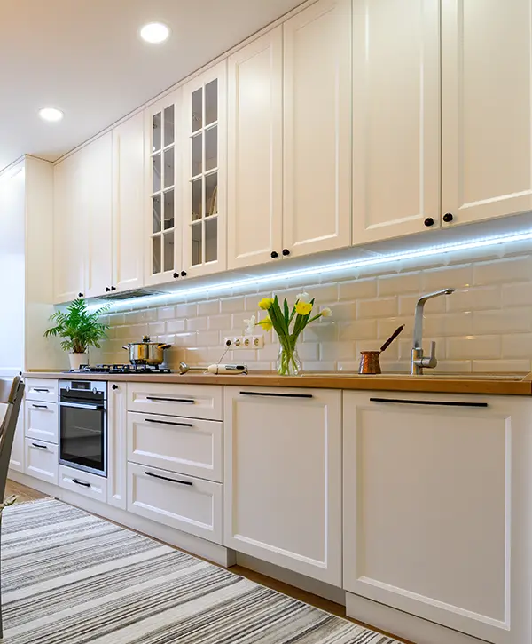 White kitchen cabinets with black pulls and knobs