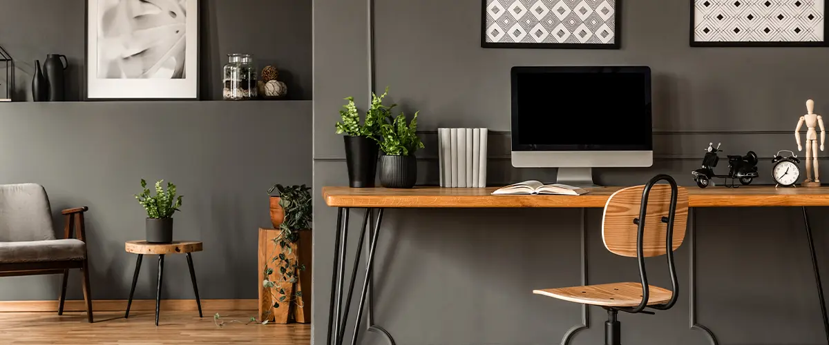 An office with gray walls and wood desk