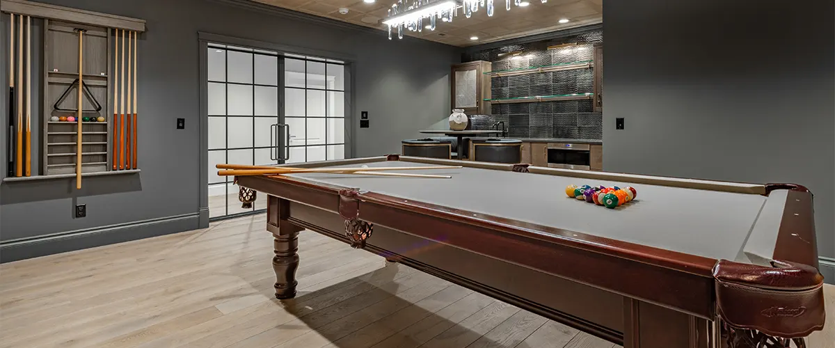 Playroom with a pool table