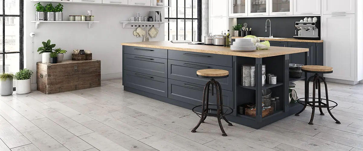 A black kitchen island with luxury vinyl plank flooring for a kitchen remodel in Springfield, NE