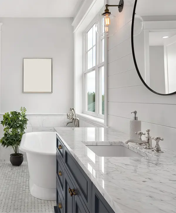 Navy blue vanity with quartz countertop