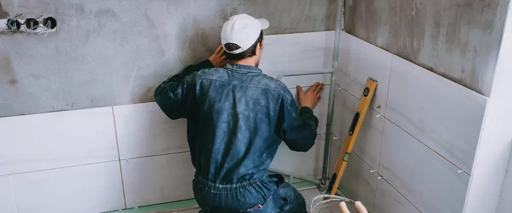 Worker Tiling A Bathroom In Papillion