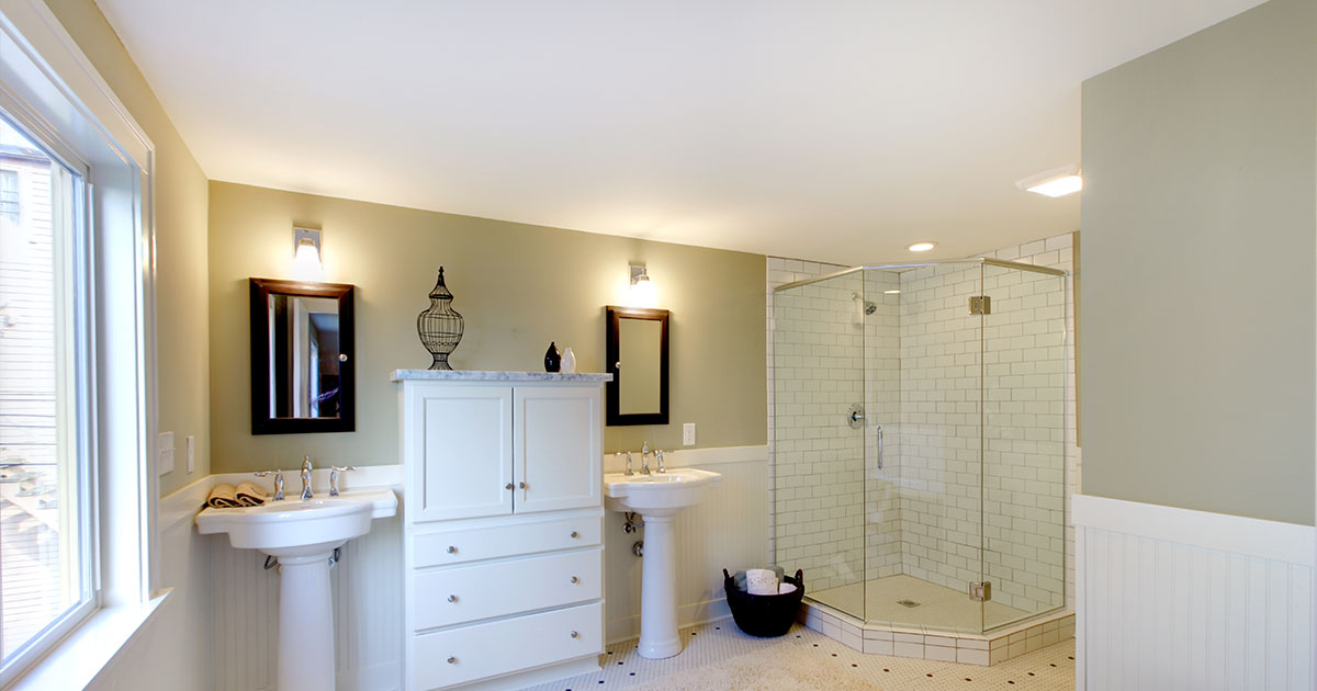 Elegant Papillion bathroom with best tile for shower walls, dual sinks, and white vanity.